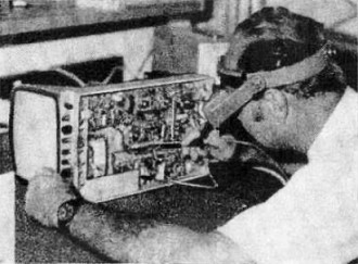Electronics technician checks a hospital CCTV monitor unit - RF Cafe