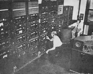The monitoring officer in the foreground adjusts the receiver of a station to be monitored a few minutes later - RF Cafe